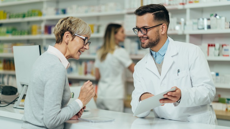 pharmacist consulting with a female customer