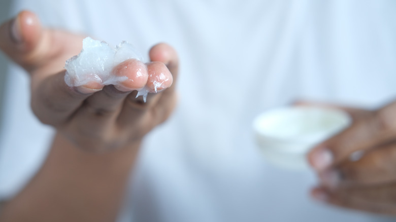 Hand covered in petroleum jelly 