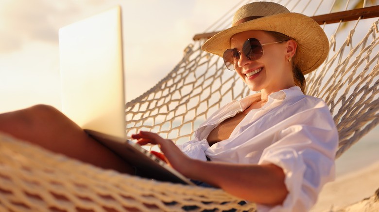 woman wearing hat and sunglasses