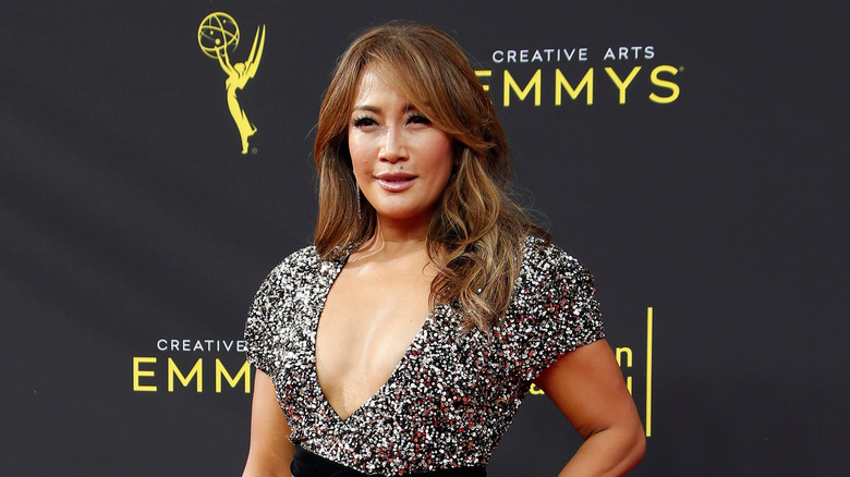 Carrie Ann Inaba posing at the Emmy Awards