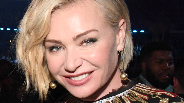 Portia de Rossi with a blonde bob, smiling