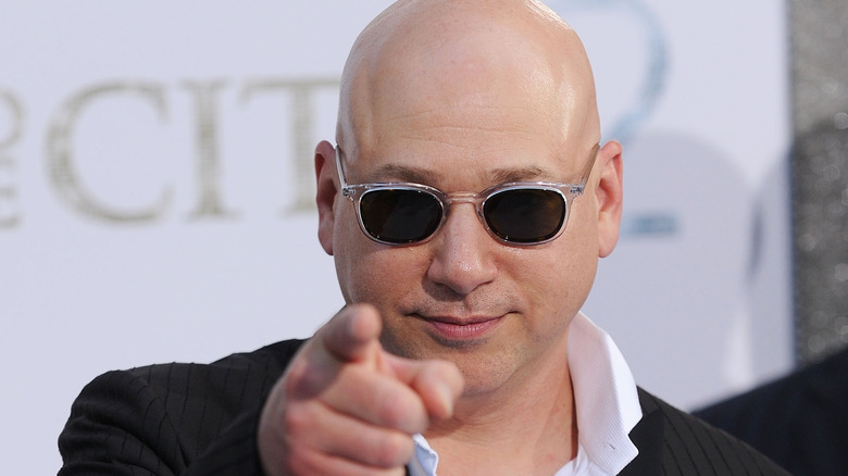 Evan Handler pointing at the camera