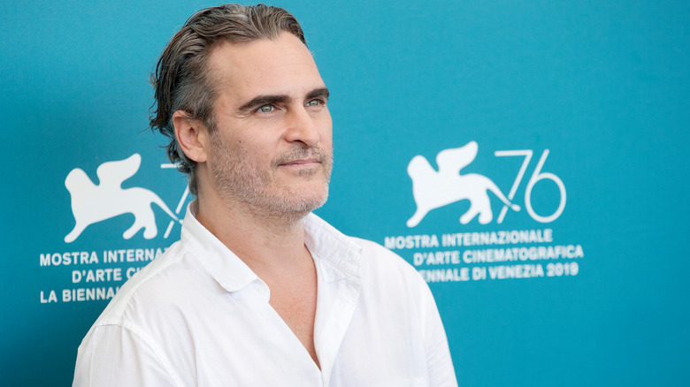 Joaquin Phoenix in white shirt