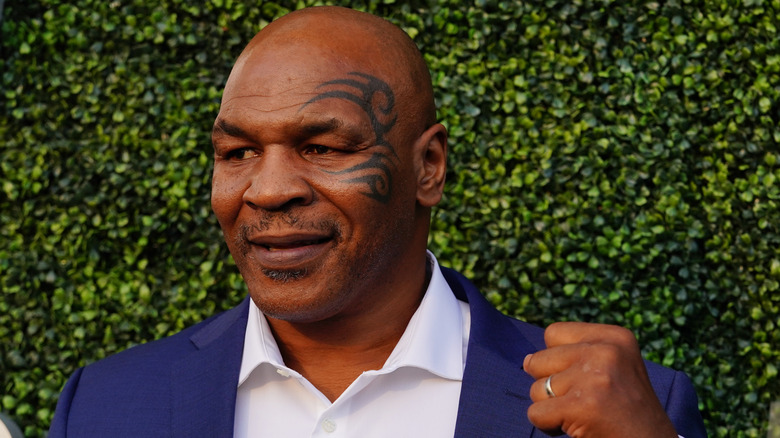 Mike Tyson in navy suit