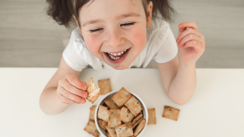 child eating crackers