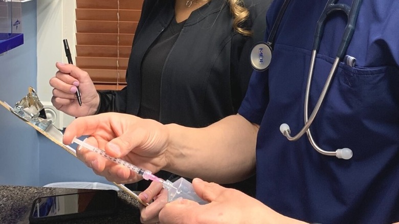 Medical professionals preparing a ketamine treatment for a patient