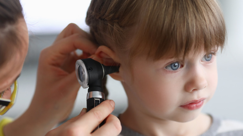 ENT examines child for ear infection