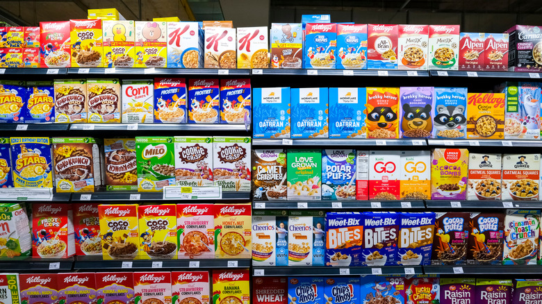 A large display of breakfast cereals in a grocery store