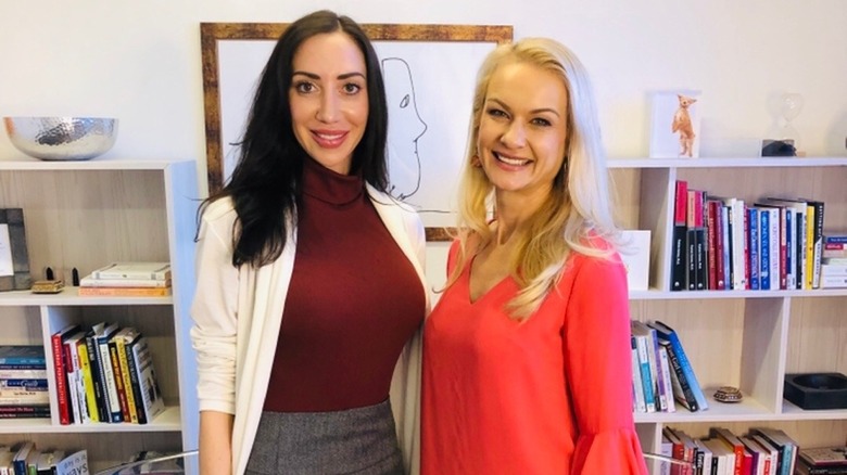 Dr. Kate Balestrieri smiling in an office with a colleague