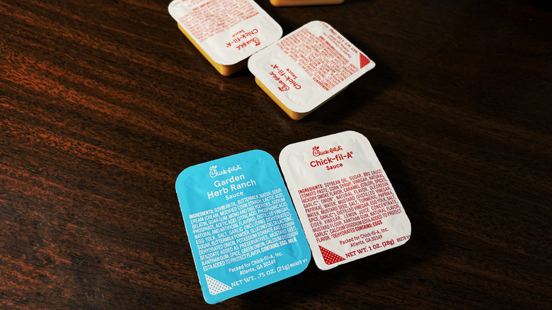 A handful of Chick-fil-a sauces