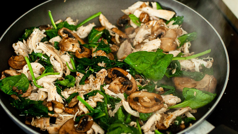 chicken and spinach in pan 