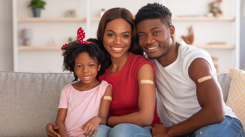 Vaccinated man, woman, and girl 