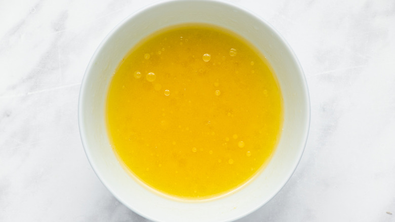 yellow dressing in bowl