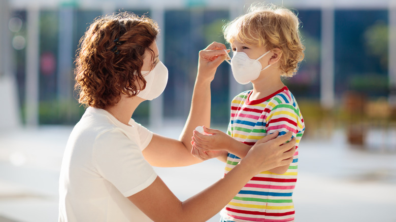 mother and son with mask