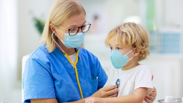 doctor examine child