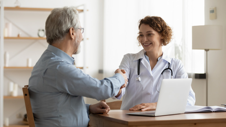 Doctor and patient shaking hands