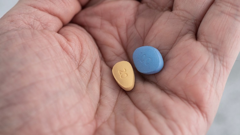 Viagra and Cialis in man's hand