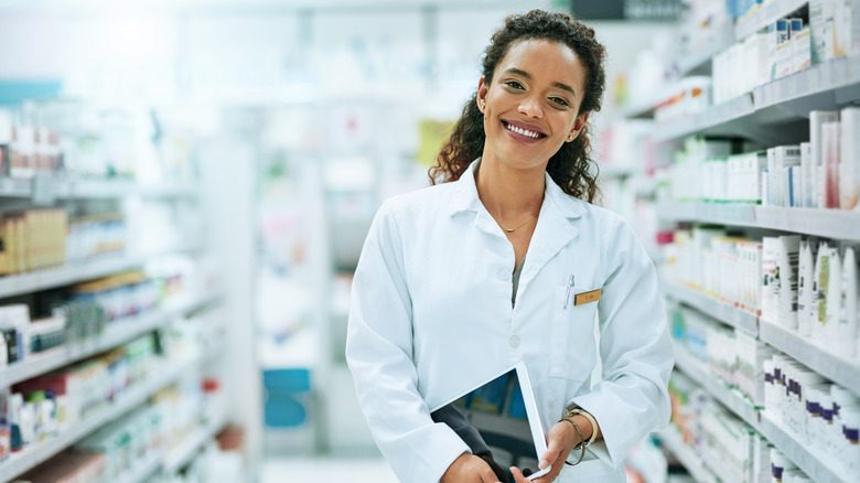 Smiling healthcare professional in drugstore