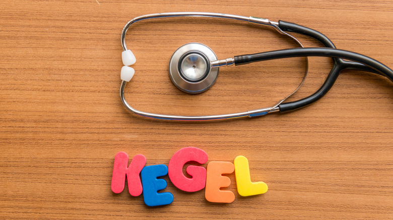 Kegel word with stethoscope on wooden table