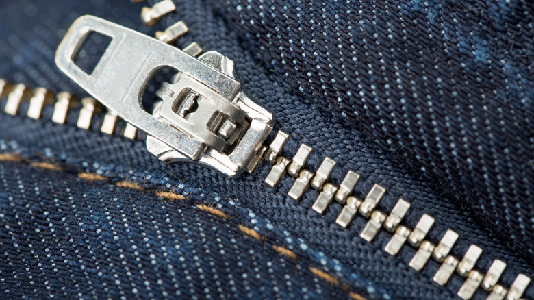 Metal zipper on blue material