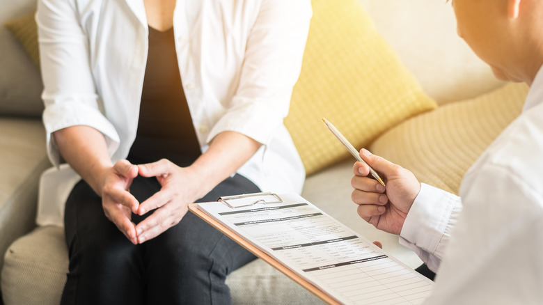 A doctor consulting a patient