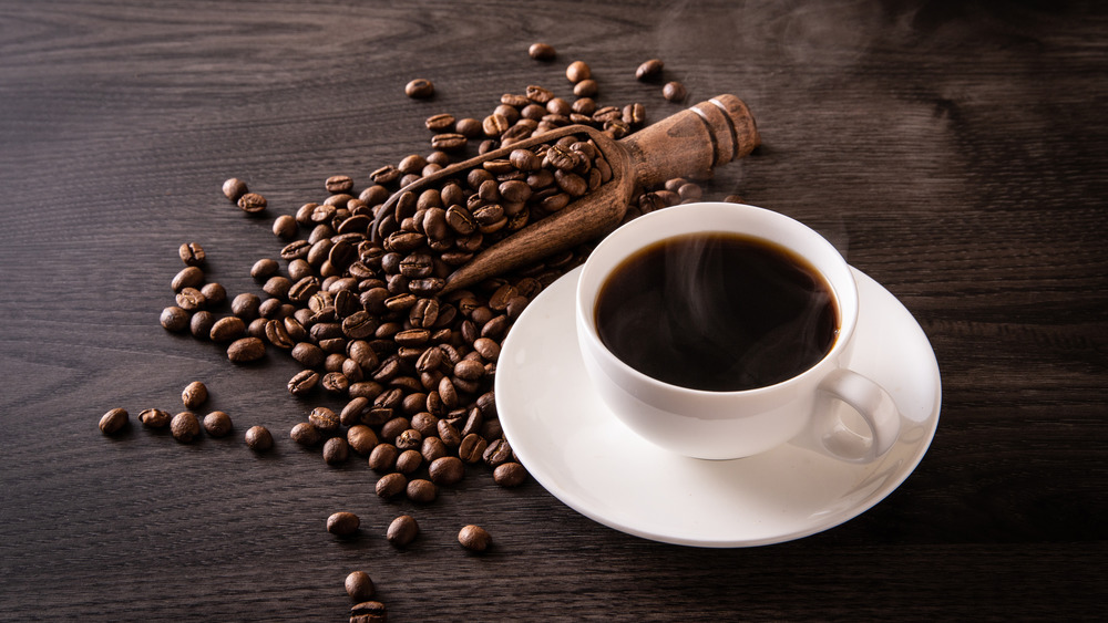 coffee beans and a coffee cup