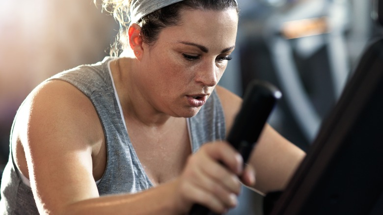 Woman working out on an elliptical machine