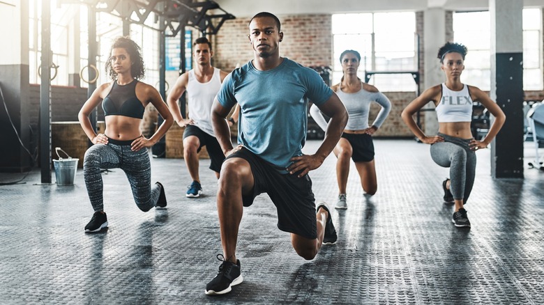 A group of people doing lunges