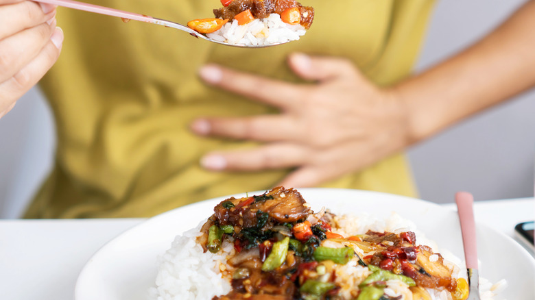 woman experiencing GERD while eating