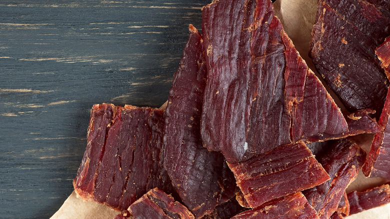 beef jerky on a wooden board