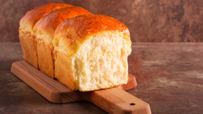 a loaf of bread on a cutting board