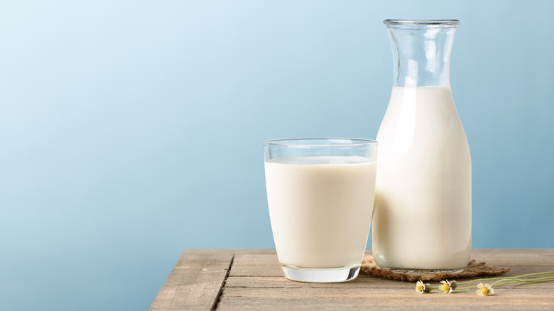 a bottle and glass of milk