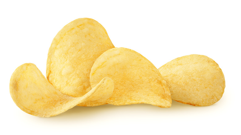 four potato chips against a white background