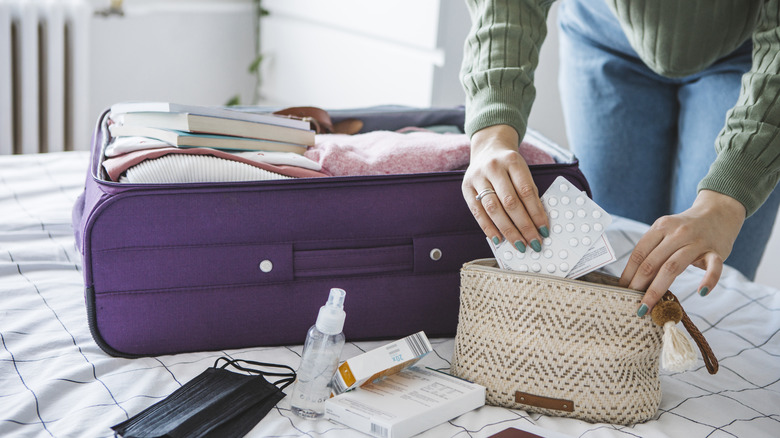 Woman packing her medicine bag