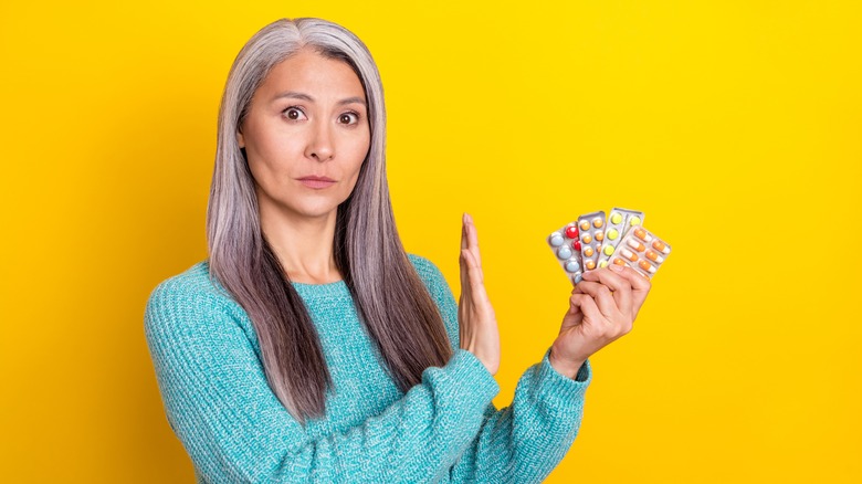 Woman signaling to banned medications