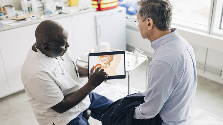 A man reviewing prostate information with his doctor