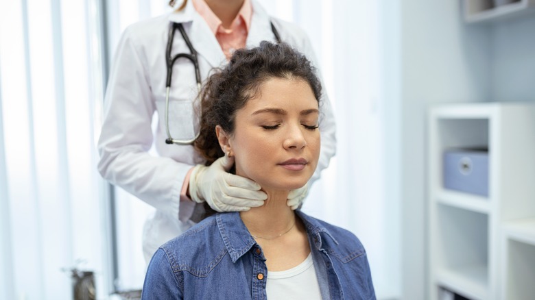 doctor examining throat