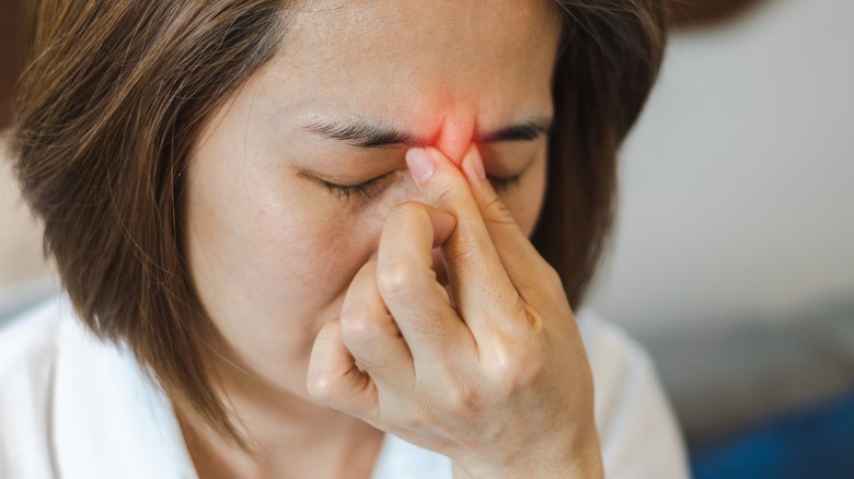Woman with pain from sinusitis