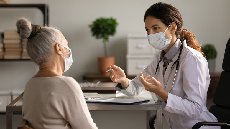 Older woman discussing her options with a doctor