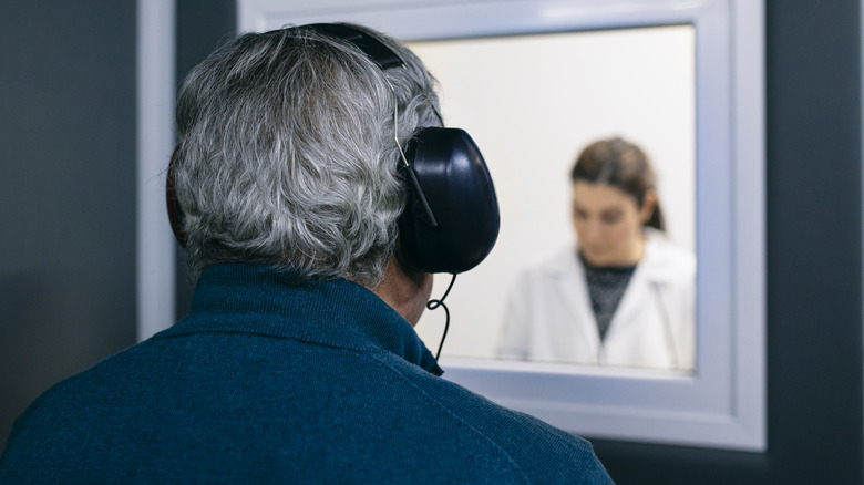 Man undergoing hearing test at doctor's office