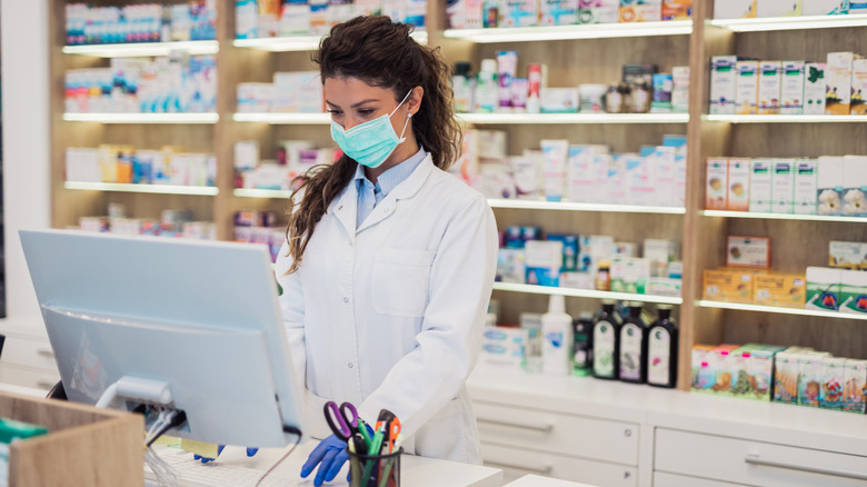 woman at desk in pharmacy