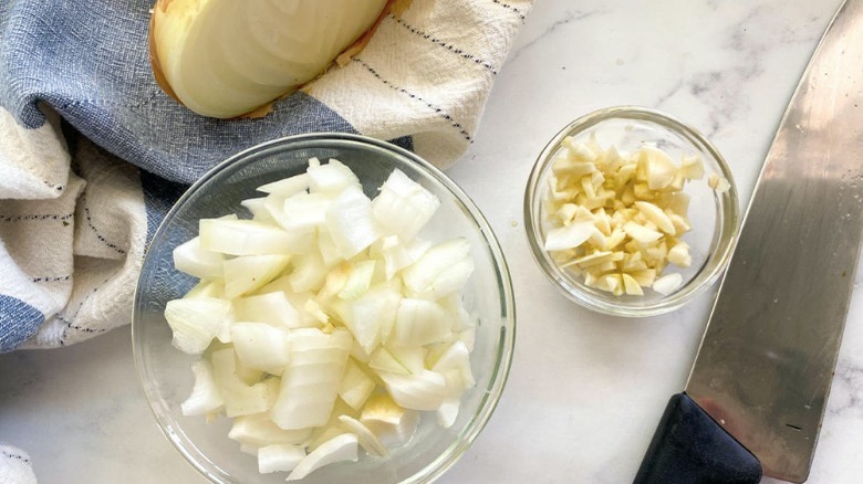 chopped onion and garlic with knife