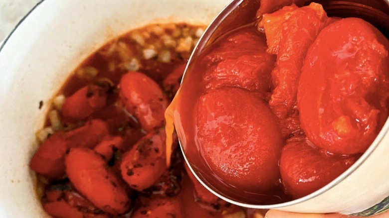 canned tomatoes in pot