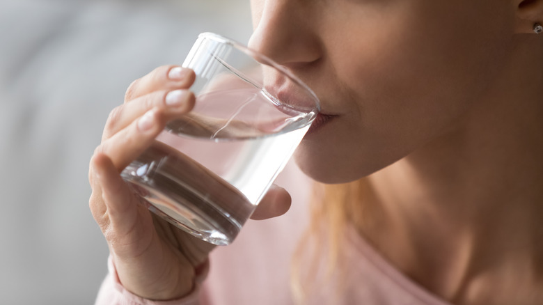 Close up of a woman drinking water