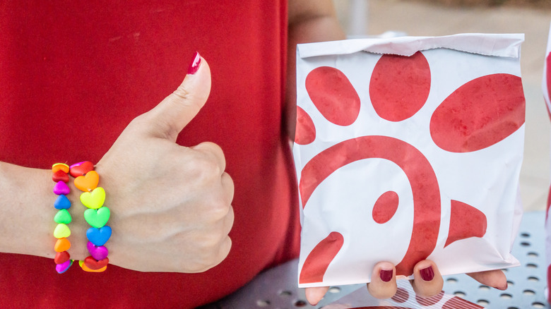 person holding a Chick-fil-A sandwich