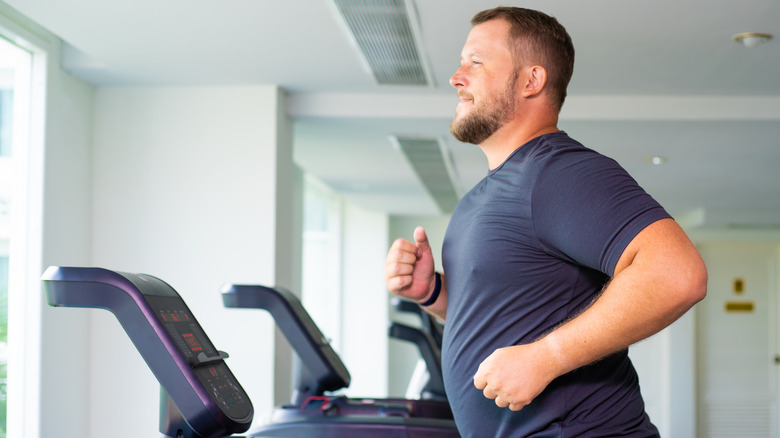 man running on treadmill