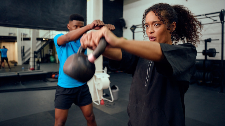 kettlebell swing with trainer