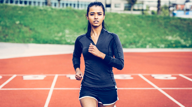 woman running on track