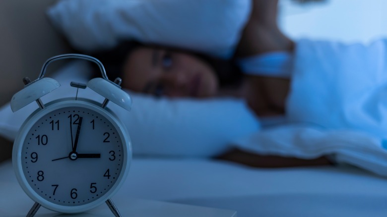 Woman in bed unable to sleep