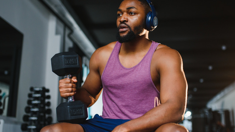 man lifting weights